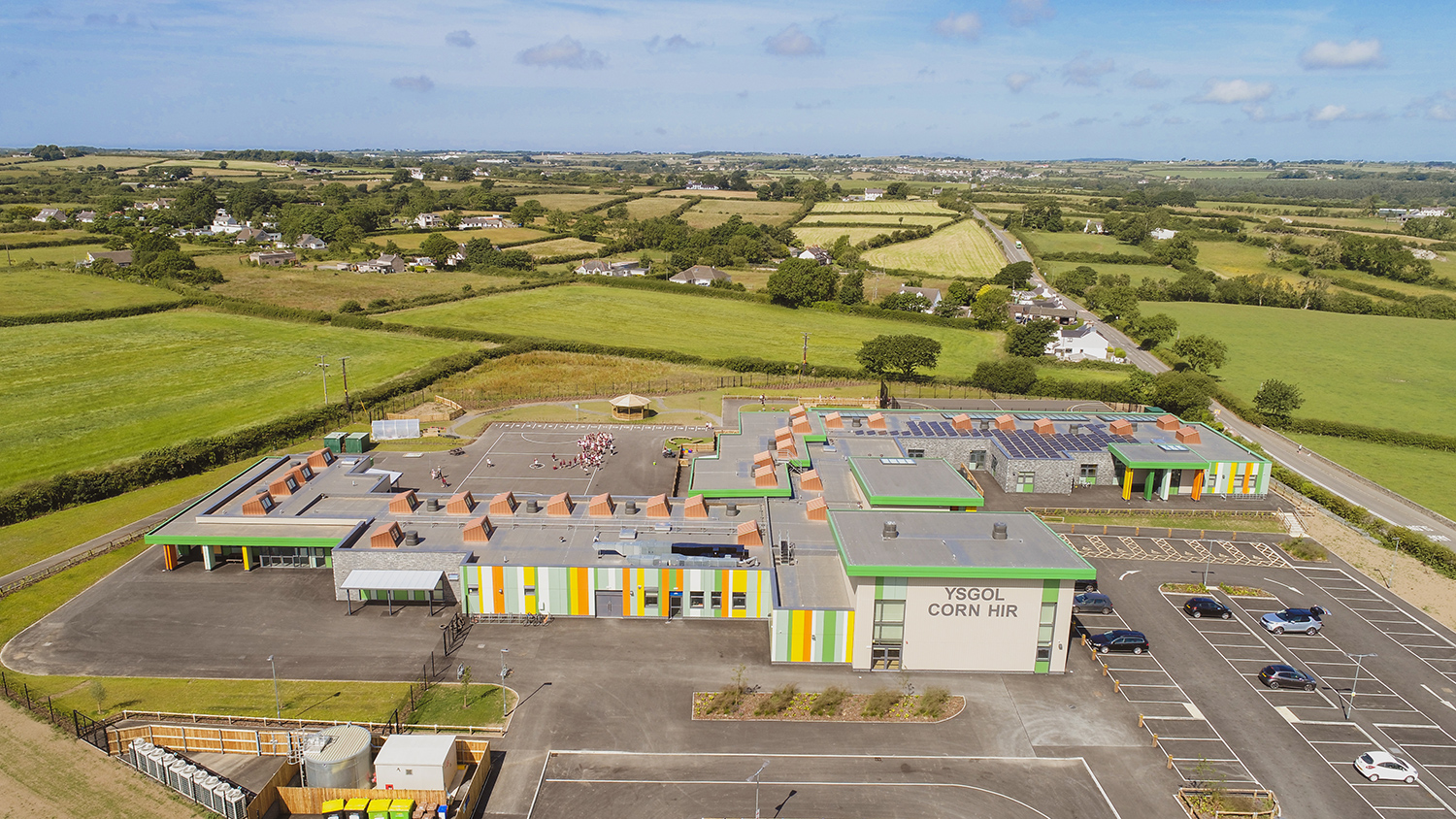 An aerial photograph of Ysgol Corn Hir showing the school surrounded by countryside